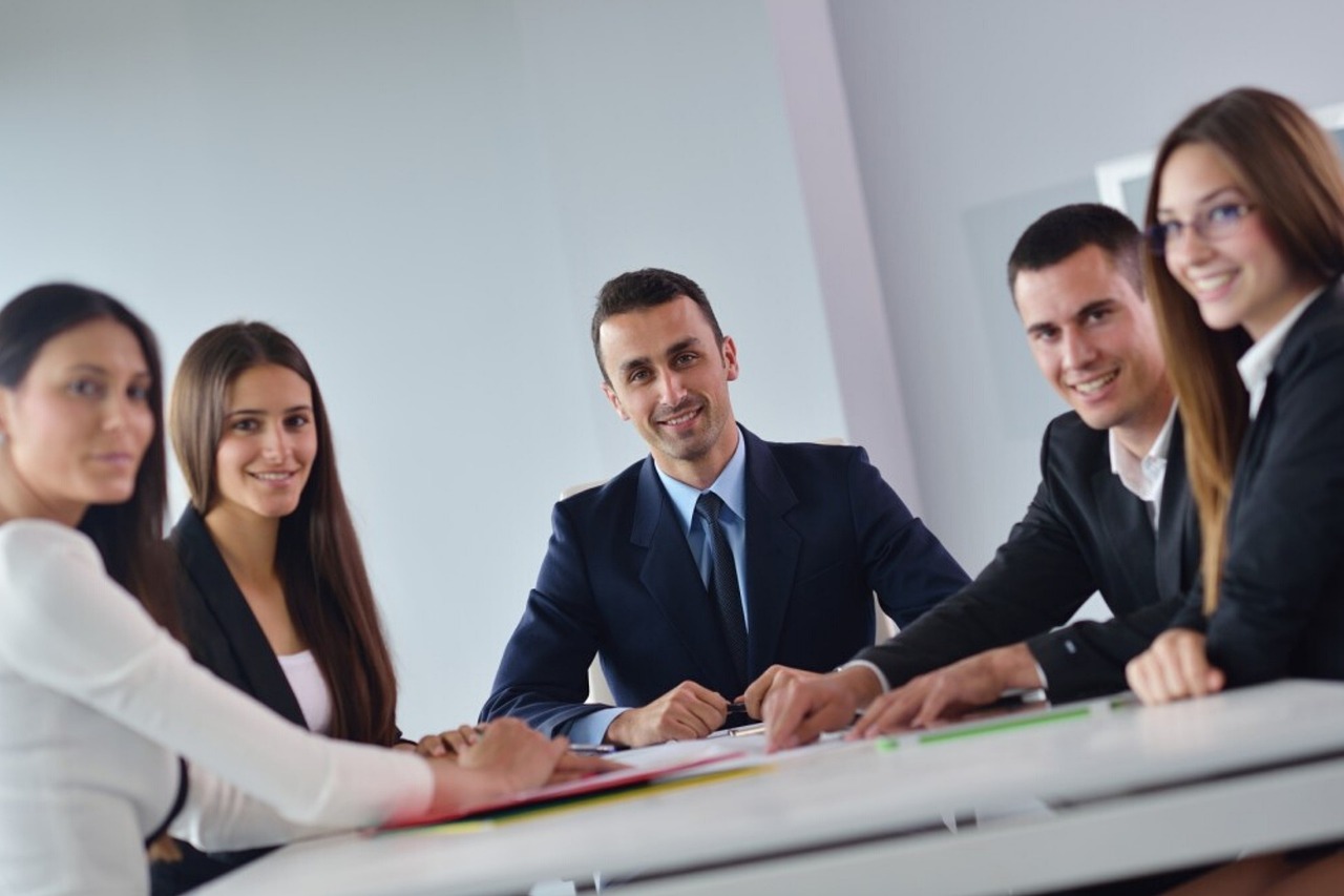 Professional business acquisition team meeting with clients
